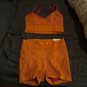 Orange and pink sports bra and short set